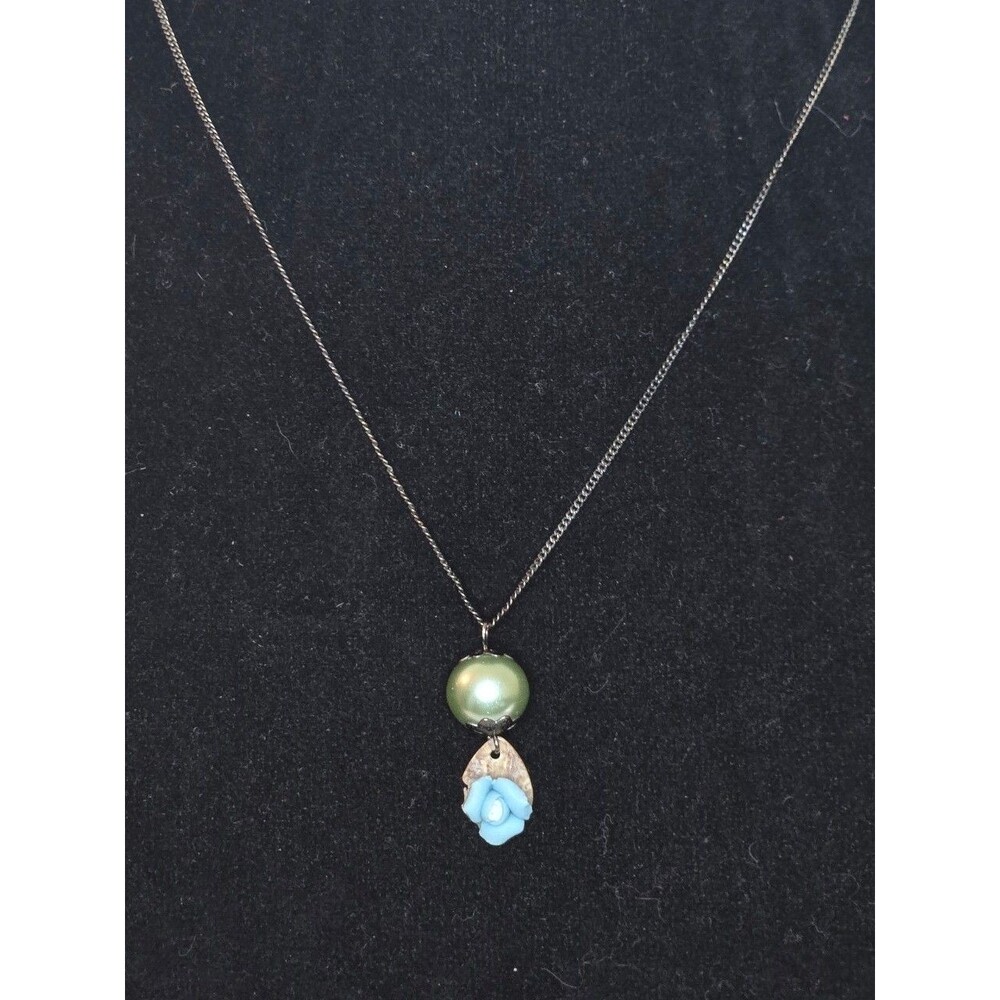 Dark Metal Necklace with Blue Bead and Ceramic Rose Pendant